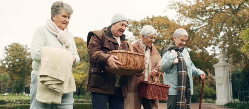 Group of elderly friends going on a fall picnic
